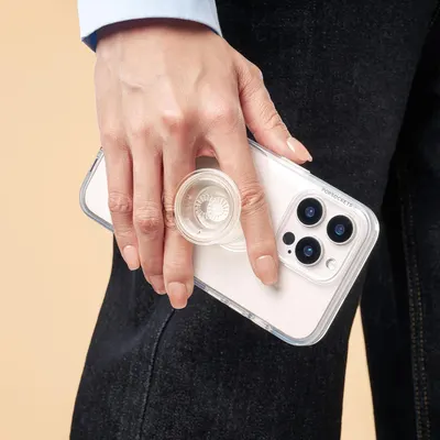 Demonstrates the product in a real-world context, showing how the phone case with integrated grip accessory looks and functions when held by a user.