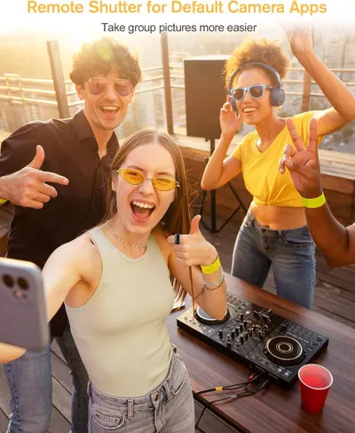 Demonstrates how the remote shutter feature makes it easier to take group pictures by allowing everyone to be in the photo without needing someone to hold the camera.