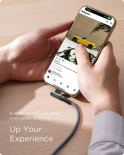 Demonstrates that the charging cable is designed to stay out of the way during phone use, allowing users to comfortably browse and interact with their device while charging.