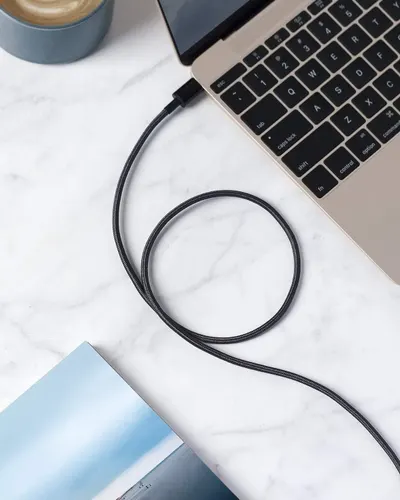 Demonstrates the product in a real-world professional environment to help shoppers visualize how the cable fits into their daily work routine.