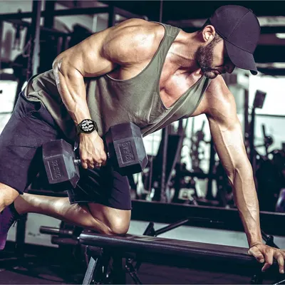 Demonstrates the product (likely fitness apparel or accessories) in an authentic gym environment to help shoppers visualize real-world usage and connect with an active lifestyle.