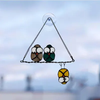 Shows the complete stained glass bird ornament product in a clean, unobstructed view to help shoppers see the design, colors, and craftsmanship clearly.