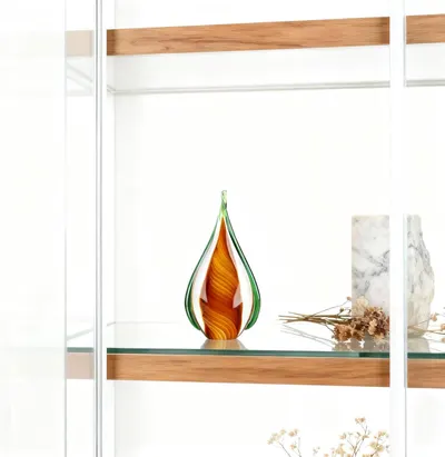 Shows the decorative glass art piece styled in a modern home setting to help shoppers visualize how it would look displayed in their own space.