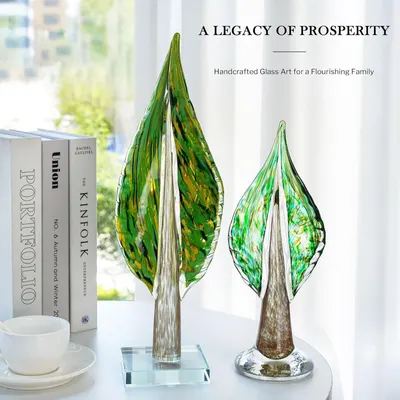 Showcases the glass art pieces in an elegant home setting to help shoppers visualize the product as sophisticated decor that enhances their living space.