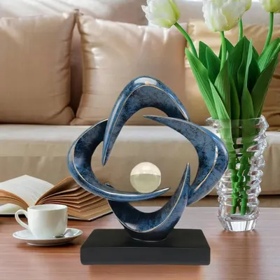 Demonstrates how the decorative sculpture fits naturally into a living space, helping shoppers visualize the product in their own home environment.