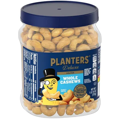 Displays the product in its retail packaging on a clean white background to give shoppers a clear view of what they will receive, including the jar, label, and visible cashews inside.