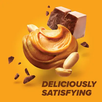 Communicates the delicious, satisfying taste of the product by showcasing its premium ingredients (peanut butter, chocolate, peanuts) in an appetizing, visually appealing way.