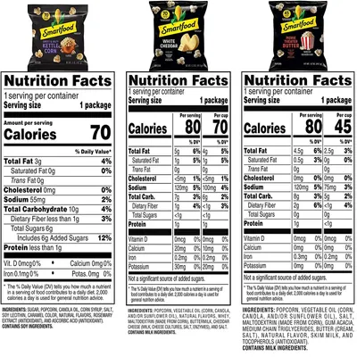 Displays the brand's product lineup side-by-side with nutrition facts for three different Smartfood popcorn flavors, helping shoppers compare options and choose their preferred variety.