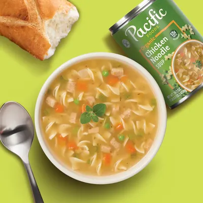 Shows the product in a real-world dining context to help shoppers visualize the soup as part of a comforting meal experience.