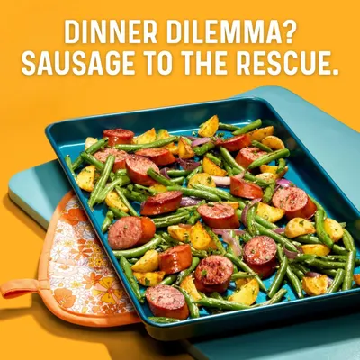 Demonstrates the product as a convenient solution for easy weeknight dinners by showing it prepared in a complete, appetizing one-pan meal with vegetables. Highlights the convenience benefit of…