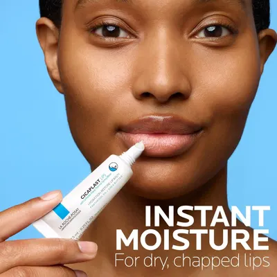 Communicates the primary benefit of the lip balm product—providing instant moisture to dry, chapped lips—through a clean lifestyle photo with a single clear text callout.
