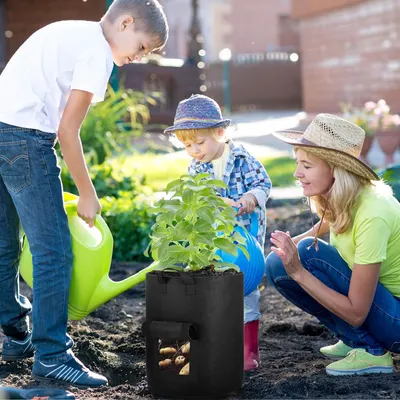 Demonstrates the product in use within a real-world outdoor gardening context with a family, creating an emotional connection and showing practical application.