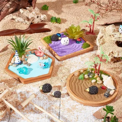 Showcases the product in a creative, real-world setting to help shoppers visualize how the miniature zen garden kits can be arranged and displayed, emphasizing their decorative and calming aesthetic.