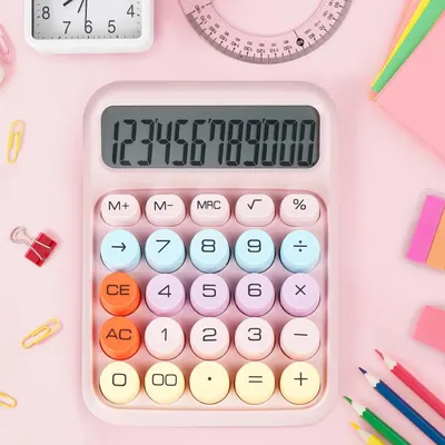 Displays the calculator product in a clean, styled flat-lay setting to show its design, color scheme, and button layout without distracting text or callouts.