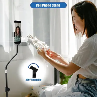 Demonstrates the cell phone stand's versatility with hands-free use for video calls and its 360-degree rotation feature, reassuring shoppers of its flexibility and convenience.