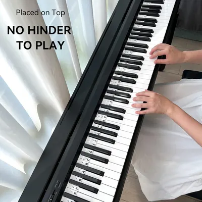 Demonstrates that the keyboard can be placed on top of furniture without blocking the player's ability to play, emphasizing its slim, space-efficient design.