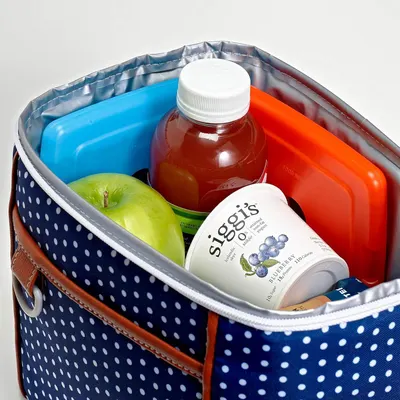 Demonstrates the product in a real-world context showing how it can be used to carry lunch items including drinks, snacks, and fresh fruit, helping shoppers visualize practical everyday use.