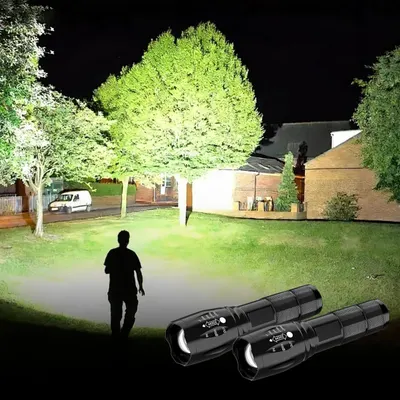 Demonstrates the flashlight's powerful illumination capability in a real-world nighttime outdoor scenario, showing how effectively it lights up a large area including trees, buildings, and pathways.
