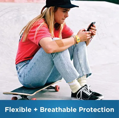 Communicates that the product (likely a bandage or protective patch visible on the person's arm) offers comfortable, flexible protection that allows breathability during active use.