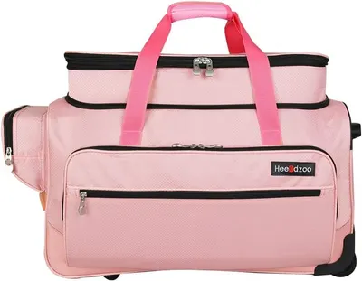 Provides a clean, catalog-style view of the pink rolling duffel bag to show its design, color, compartments, and overall appearance without distractions.