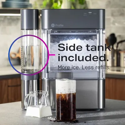 Highlights that the ice maker includes an additional side tank accessory, emphasizing the convenience of increased ice capacity and fewer refills.