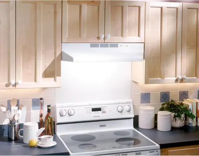Demonstrates the product (range hood) installed in a real kitchen setting to help shoppers visualize how it looks and fits in their own home environment.