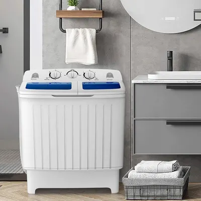 Demonstrates how the portable washing machine fits naturally into a modern bathroom environment, helping shoppers visualize the product in their own home.