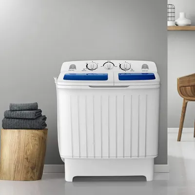 Shows the portable washing machine in a real-world home setting to help shoppers visualize how it fits into their living space and daily routine.