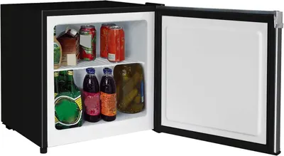 Demonstrates the product in a real-world usage scenario, showing the mini fridge stocked with beverages and food items to help shoppers visualize capacity and practical application.