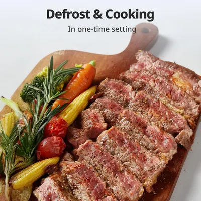 Communicates the convenience of being able to defrost and cook food in a single setting, saving time and simplifying meal preparation.