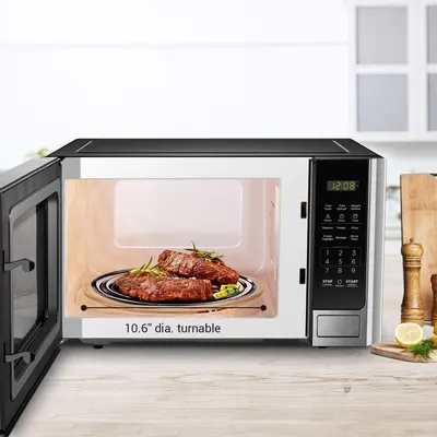 Communicates the interior capacity of the microwave by showing the exact turntable diameter measurement, helping shoppers understand how much food can fit inside. Demonstrates the spacious interior…