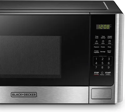 Provides a clean, catalog-style view of the microwave showing its control panel, digital display, and BLACK+DECKER branding to help shoppers understand the product's appearance and interface.