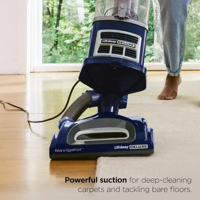 Communicates the vacuum's powerful suction capability for deep-cleaning carpets and bare floors, reassuring shoppers of its cleaning effectiveness.