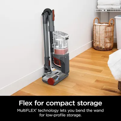 Demonstrates the vacuum's MultiFLEX technology that allows the wand to bend for low-profile, space-saving storage in tight spaces.