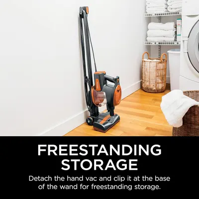 Demonstrates the vacuum's convenient freestanding storage capability, showing shoppers that the product can be stored compactly without wall mounting by detaching the hand vac and clipping it to the…