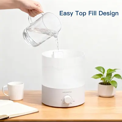 Demonstrates the convenience of the top-fill design, showing how easy it is to refill the humidifier without removing the tank. Shows shoppers how to fill the humidifier using the top-fill opening,…