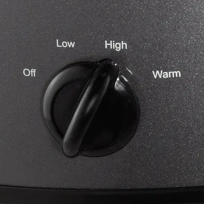 Shows the product's control interface with labeled settings (Off, Low, High, Warm) to help shoppers understand how to operate the appliance and what temperature/heat options are available.