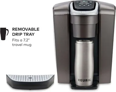 Highlights the removable drip tray feature and its compatibility with a 7.2 inch travel mug, demonstrating the product's versatility and convenience for different mug sizes. Communicates that the…