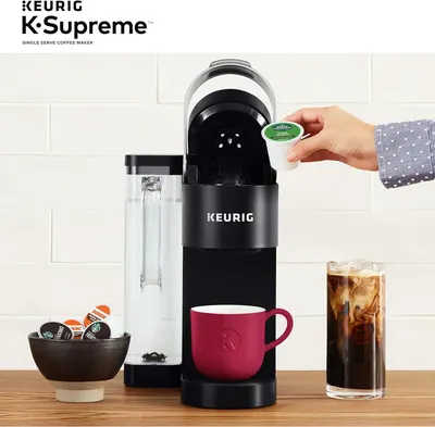 Demonstrates how simple it is to use the Keurig K-Supreme by showing a hand inserting a K-Cup pod into the machine, reassuring shoppers about ease of use. Highlights the convenience and simplicity…