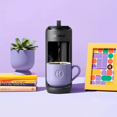 Showcases the Keurig coffee maker in a stylish, real-world home environment to help shoppers visualize the product in their own space and lifestyle.