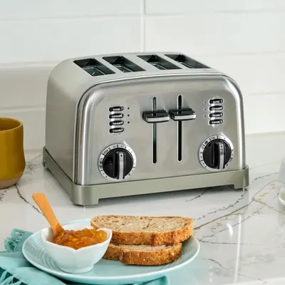 Shows the toaster in a real-world kitchen setting with breakfast items to help shoppers visualize the product in their daily routine.