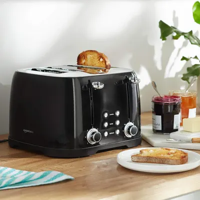 Shows the toaster in a real-world breakfast context to help shoppers visualize the product in their own home and daily routine.