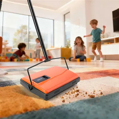 Demonstrates the product in a real-world family setting, showing it cleaning up crumbs on a carpet while children play in the background, helping shoppers visualize the product in their own homes.