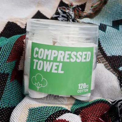 Shows the customer what they receive in the package—a clear container with 120 compressed cotton towels—to communicate quantity and value.