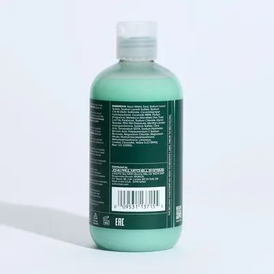 Provides a clean, catalog-style view of the product bottle showing the back label with ingredients and distributor information for shopper reference.
