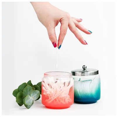 Demonstrates how to use the product by showing a hand inserting a wick into the candle jar, communicating the simple setup process for making candles. Highlights the simplicity and ease of using the…