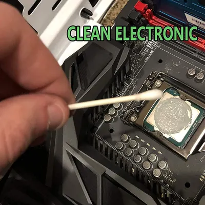 Demonstrates how to clean electronic components, specifically showing the process of cleaning a computer motherboard to reassure shoppers about proper maintenance techniques.