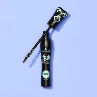 Shows the mascara product with its applicator wand extended to give shoppers a clear view of the brush design and product packaging in a clean, catalog-style presentation.