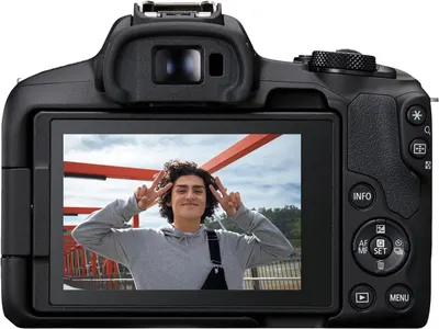 Provides a clean, catalog-style view of the camera showing its back display screen with a sample photo, allowing shoppers to see the product's design and screen quality.