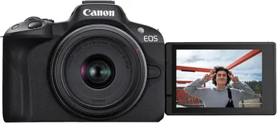 Demonstrates the camera's articulating flip-out screen feature, showing how users can see themselves while recording, ideal for vlogging and self-portraits.